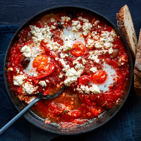 Baked eggs with tomatoes and feta